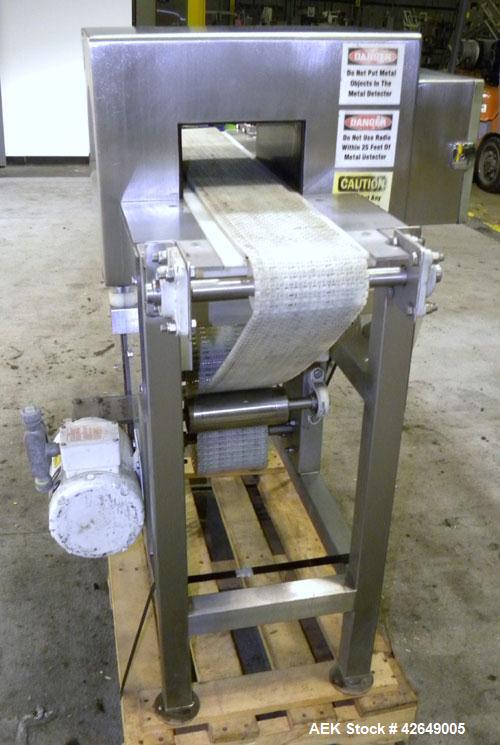 Used Goring Kerr Metal Detector, Model TEK 21 DSP. Usable aperture size 7-7/8" wide x 4-1/4" high. Includes a plastic belt conveyor, driven by a 1/2hp, 3/60/230/460 volt, 1725 rpm gear motor, ratio 2...