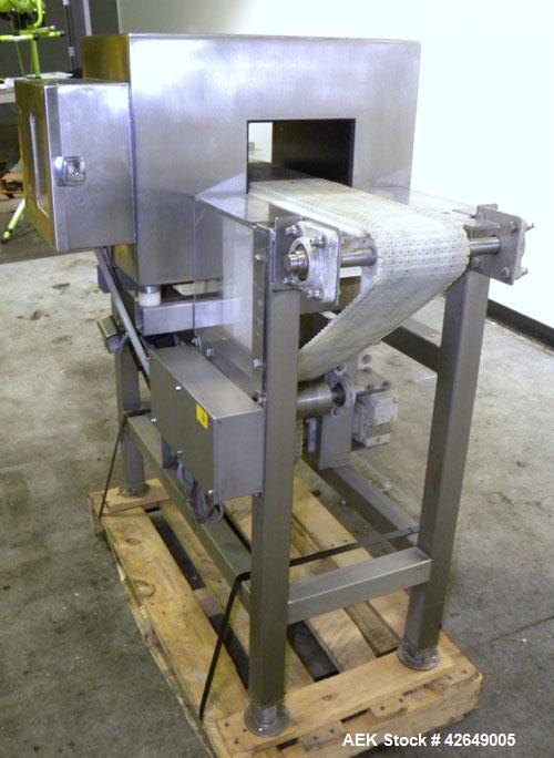 Used Goring Kerr Metal Detector, Model TEK 21 DSP. Usable aperture size 7-7/8" wide x 4-1/4" high. Includes a plastic belt conveyor, driven by a 1/2hp, 3/60/230/460 volt, 1725 rpm gear motor, ratio 2...