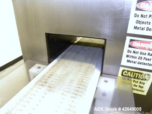 Used Goring Kerr Metal Detector, Model TEK 21 DSP. Usable aperture size 7-7/8" wide x 4-1/4" high. Includes a plastic belt conveyor, driven by a 1/2hp, 3/60/230/460 volt, 1725 rpm gear motor, ratio 2...