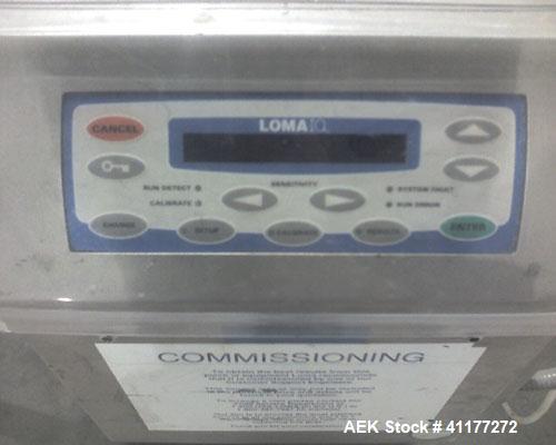 Used Loma IQ series metal detector. Has 16"W x 5"H aperature. Ferrous 2mm, Non Ferrous 2.5mm & Stainless steel 5mm. Mounted on 90"L x 16"W conveyor with 10"w belt. Has solonoid for reject.