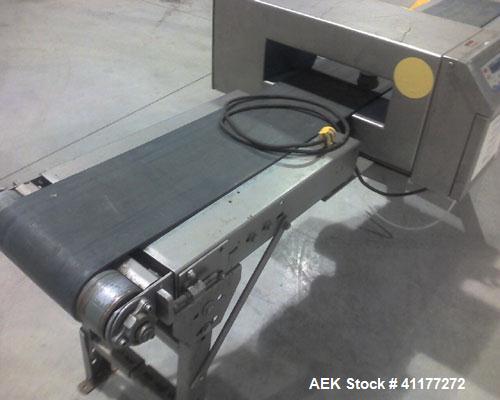 Used Loma IQ series metal detector. Has 16"W x 5"H aperature. Ferrous 2mm, Non Ferrous 2.5mm & Stainless steel 5mm. Mounted on 90"L x 16"W conveyor with 10"w belt. Has solonoid for reject.