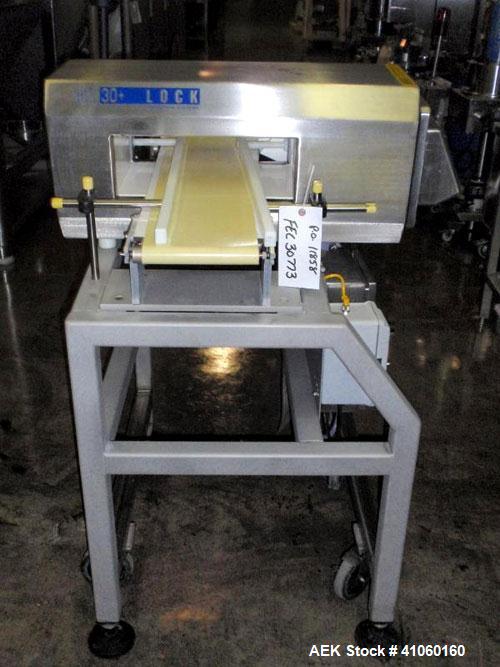 Used Lock Inspection Systems Metal Detector, Model MET 30+, belt thru design, 14" wide x 5" high opening, 7.5" wide x 30" long belt, 115 volt with controls on stand.