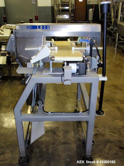 Used Lock Inspection Systems Metal Detector, Model MET 30+, belt thru design, 14" wide x 5" high opening, 7.5" wide x 30" long belt, 115 volt with controls on stand.