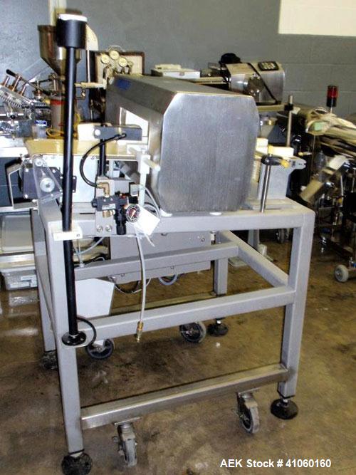 Used Lock Inspection Systems Metal Detector, Model MET 30+, belt thru design, 14" wide x 5" high opening, 7.5" wide x 30" long belt, 115 volt with controls on stand.