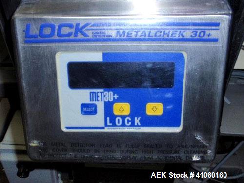 Used Lock Inspection Systems Metal Detector, Model MET 30+, belt thru design, 14" wide x 5" high opening, 7.5" wide x 30" long belt, 115 volt with controls on stand.