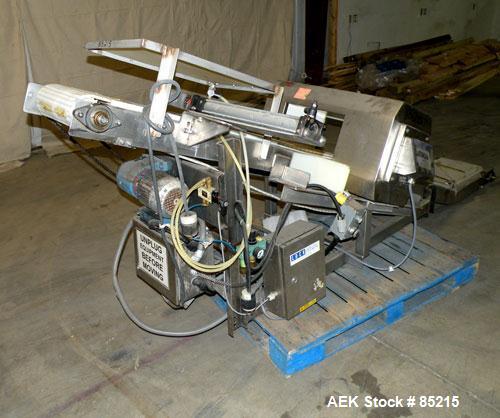 Used Lock Metalchek Metal Detector, Model 30CKE. Aperture size 14" wide x 7" high. Includes a 12" wide x 2' long bottom section x 8'6" long incline section x 46" discharge height plastic belt conveyo...