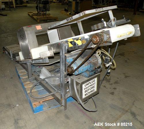 Used Lock Metalchek Metal Detector, Model 30CKE. Aperture size 14" wide x 7" high. Includes a 12" wide x 2' long bottom section x 8'6" long incline section x 46" discharge height plastic belt conveyo...