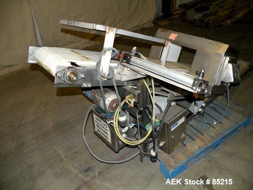 Used Lock Metalchek Metal Detector, Model 30CKE. Aperture size 14" wide x 7" high. Includes a 12" wide x 2' long bottom section x 8'6" long incline section x 46" discharge height plastic belt conveyo...