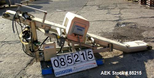 Used Lock Metalchek Metal Detector, Model 30CKE. Aperture size 14" wide x 7" high. Includes a 12" wide x 2' long bottom section x 8'6" long incline section x 46" discharge height plastic belt conveyo...