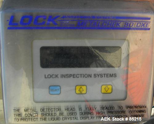 Used Lock Metalchek Metal Detector, Model 30CKE. Aperture size 14" wide x 7" high. Includes a 12" wide x 2' long bottom section x 8'6" long incline section x 46" discharge height plastic belt conveyo...