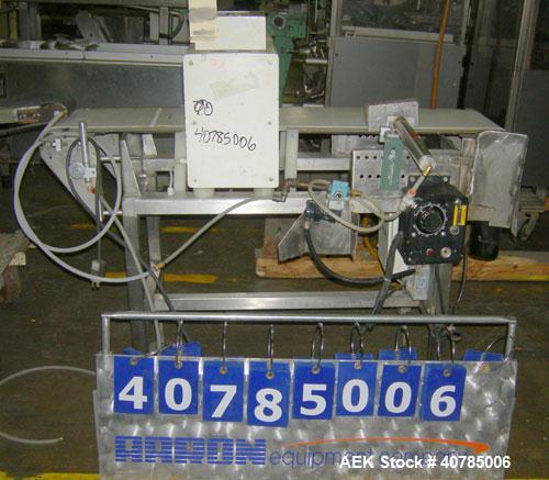 Used Lock Inspection Systems Metal Check 9 Metal Detector. 10" wide x 48" long belt.14" wide x 4 1/2" tall aperture opening. Driven by a 1/4 hp, 104 rpm DC motor with varispeed speed control, ratio 3...