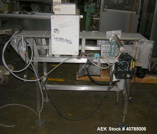 Used Lock Inspection Systems Metal Check 9 Metal Detector. 10" wide x 48" long belt.14" wide x 4 1/2" tall aperture opening. Driven by a 1/4 hp, 104 rpm DC motor with varispeed speed control, ratio 3...