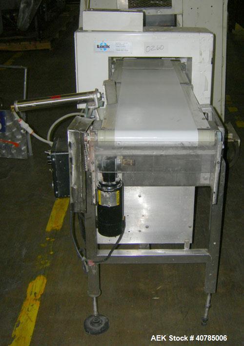 Used Lock Inspection Systems Metal Check 9 Metal Detector. 10" wide x 48" long belt.14" wide x 4 1/2" tall aperture opening. Driven by a 1/4 hp, 104 rpm DC motor with varispeed speed control, ratio 3...