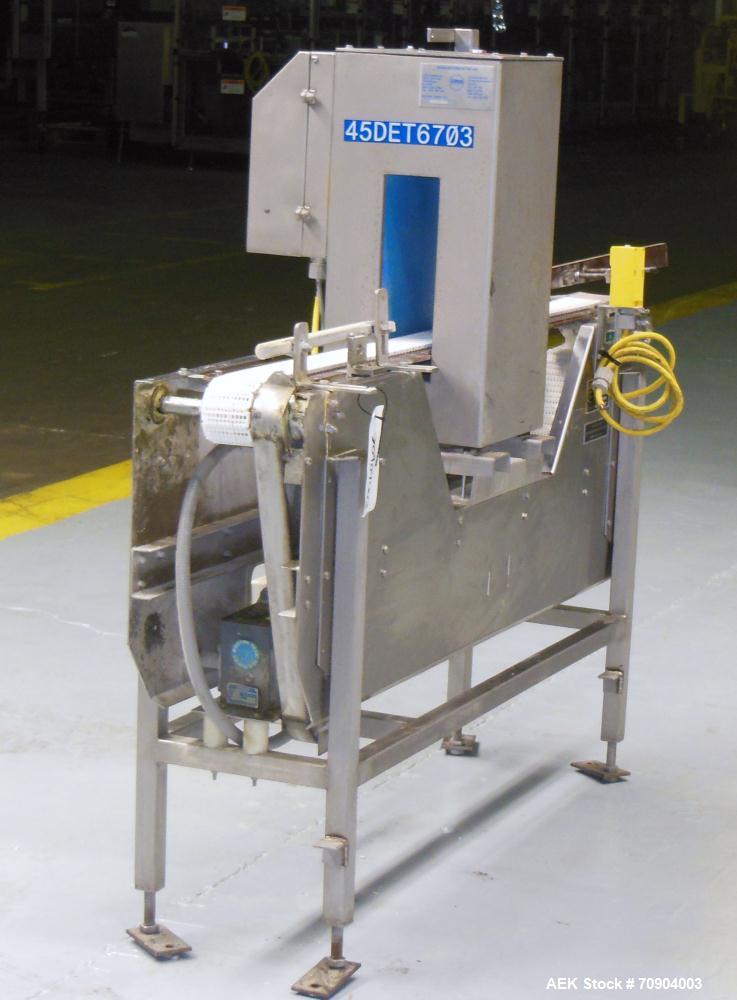 Used Loma IQ2 Conveyor Mounted Metal Detector.  Built 06/2004. Aperture size 100 mm (3-15/16") Wide x 350 mm (13-3/4 ") Tall, with belt 11-1/8" Tall. Sensitivity: up to 1.0mm Ferrous, 1.0mm Non-Ferro...