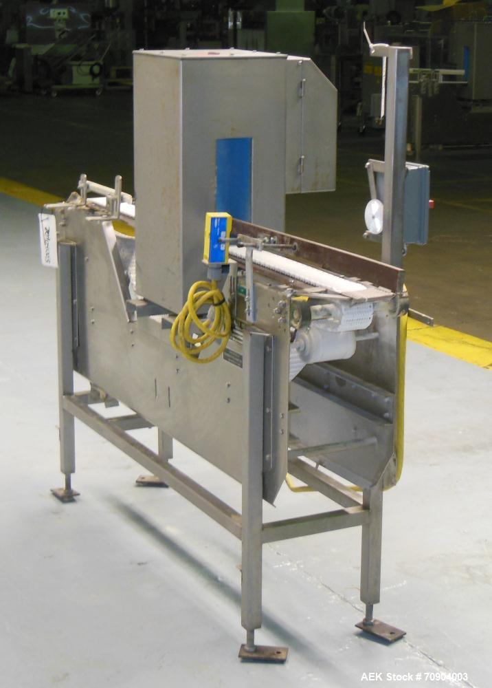 Used Loma IQ2 Conveyor Mounted Metal Detector.  Built 06/2004. Aperture size 100 mm (3-15/16") Wide x 350 mm (13-3/4 ") Tall, with belt 11-1/8" Tall. Sensitivity: up to 1.0mm Ferrous, 1.0mm Non-Ferro...