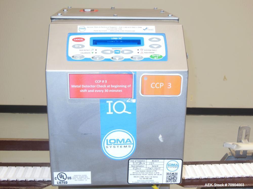 Used Loma IQ2 Conveyor Mounted Metal Detector.  Built 06/2004. Aperture size 100 mm (3-15/16") Wide x 350 mm (13-3/4 ") Tall, with belt 11-1/8" Tall. Sensitivity: up to 1.0mm Ferrous, 1.0mm Non-Ferro...
