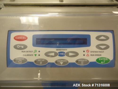 Used Loma Model IQ2 Metal Detector with conveyor and reject. Metal detector is vertical and last set up for solid dose bottling line. Head is 5"W x 10"H as 12"Deep. Includes integral chain conveyor w...