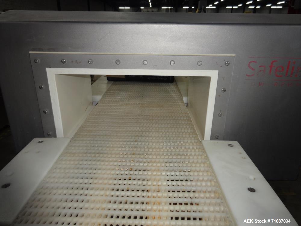 Used Mettler-Toledo Model SL 1200 Safeline Metal Detector.  Has a 13 1/2" x 7" high aperature.  Mounted over a 60" long x 12" wide conveyor.  Drive by a 1/2 HP, 1/60/115/208-230 Volt washdown motor. ...