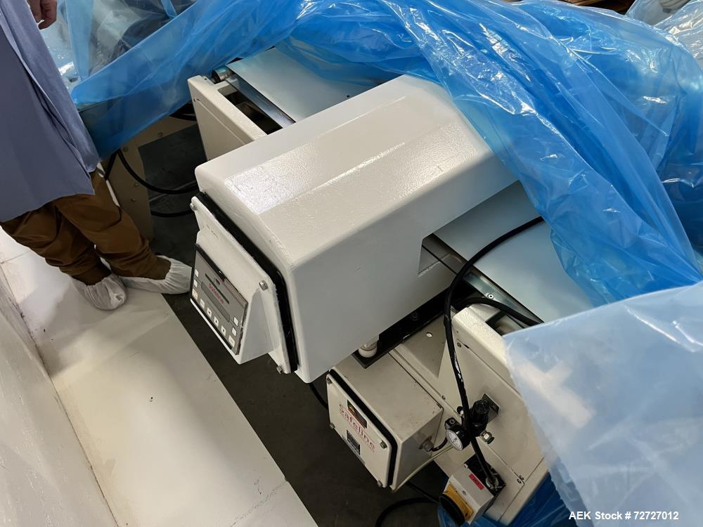 Used-Mettler-Toledo Safeline Metal Detector. Conveyor mounted, low aperture. Has mechanical reject gate.3" tall x 15-3/4" wi...