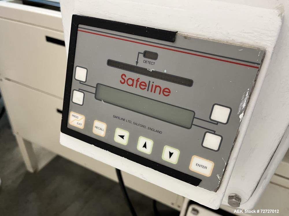 Used-Mettler-Toledo Safeline Metal Detector. Conveyor mounted, low aperture. Has mechanical reject gate.3" tall x 15-3/4" wi...