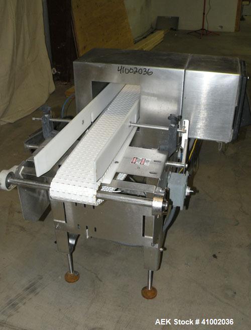 Used Ramsey Icore Metal Detector, Model Metal Scout IIE 808. Usable aperture size 7 3/4" wide x 6 1/2" high x 9 3/4" deep. Includes a Ramsey model 506 conveyor. 6" wide x 59" long plastic belt, drive...