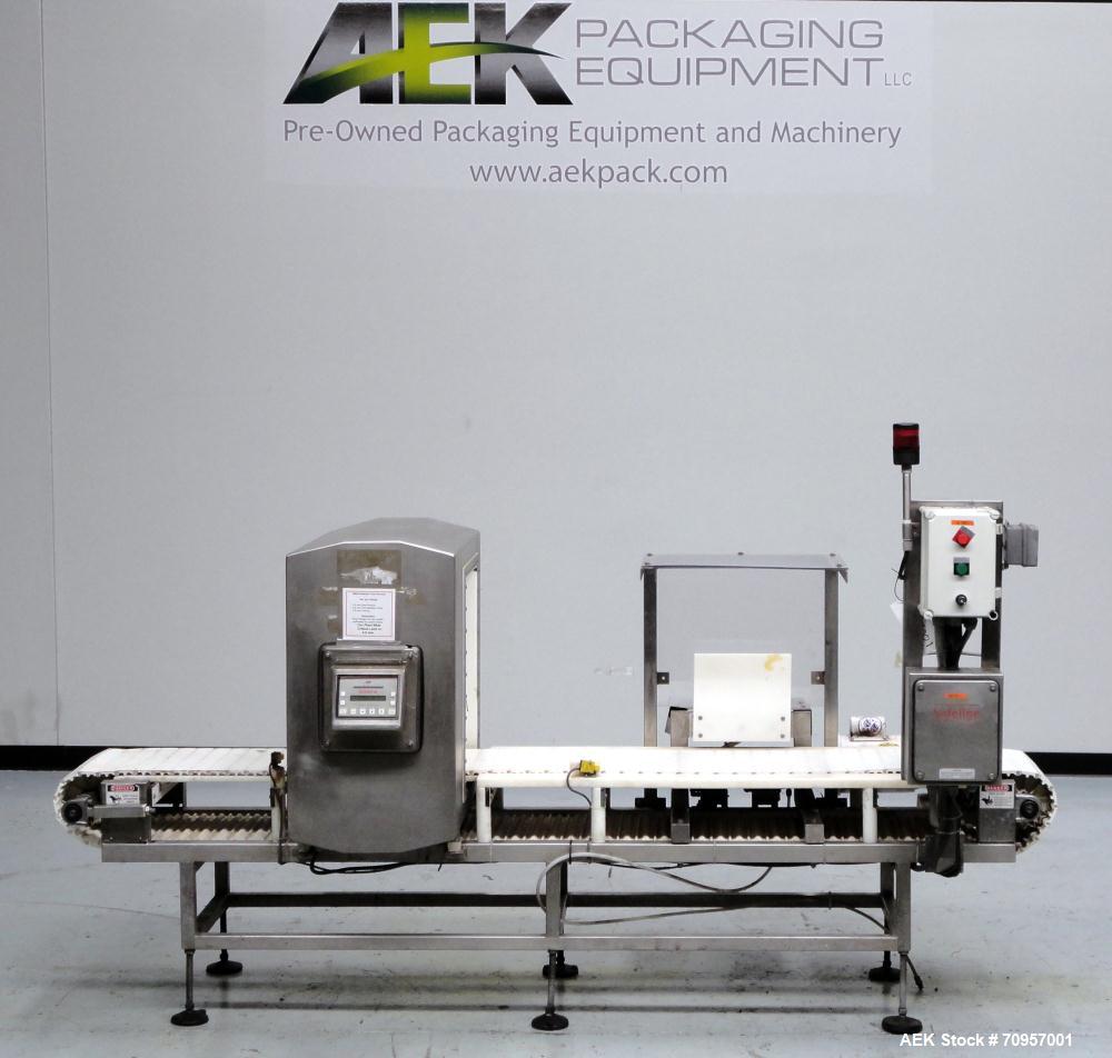 Used Safeline Model 16X22 Metal Detector. Has 16" wide(400mm) x 22" tall (550mm) product aperature, and 20-1/2" tall with current belt, 300 KHz Frequency. Mounted on 108" long x 14" wide conveyor wit...