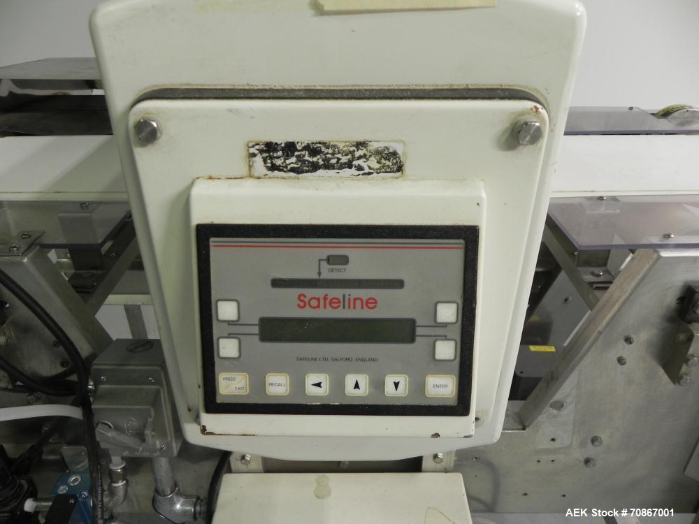 Used Safeline Model 250X150 Metal Detector. Has a 10" (wide) by 5.25" product aperature. Mounted on a Goring Kerr 48" (long) by 12" (wide) aluminum conveyor with Air Knife reject station. Has a 1.07 ...