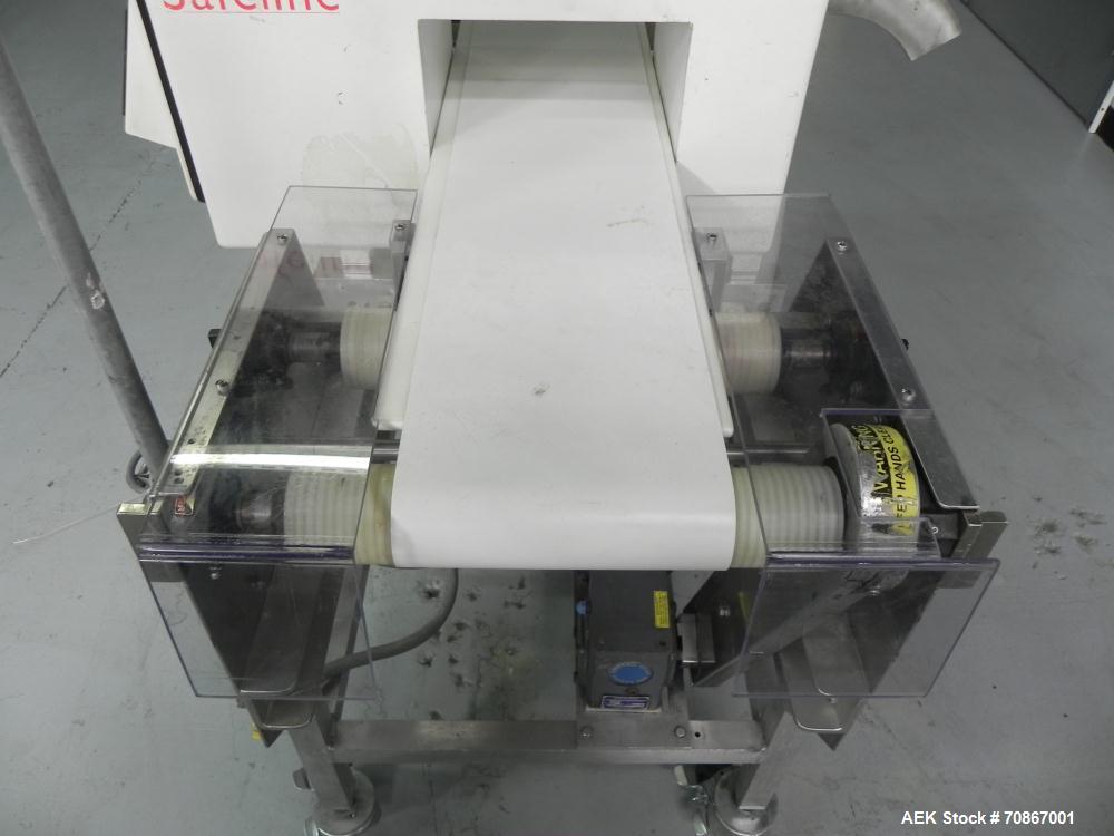 Used Safeline Model 250X150 Metal Detector. Has a 10" (wide) by 5.25" product aperature. Mounted on a Goring Kerr 48" (long) by 12" (wide) aluminum conveyor with Air Knife reject station. Has a 1.07 ...
