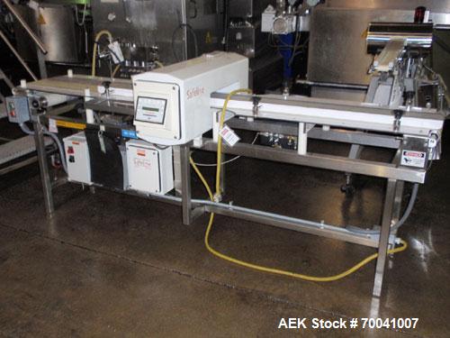 Used Safeline Metal Detector, Model 4500-003-033. Aperture size 14" wide x 2-3/4" high. Includes a control panel, air reject, and a belt conveyor 12" wide x 96" long belt, driven by a 1/2 hp, 3/60/23...