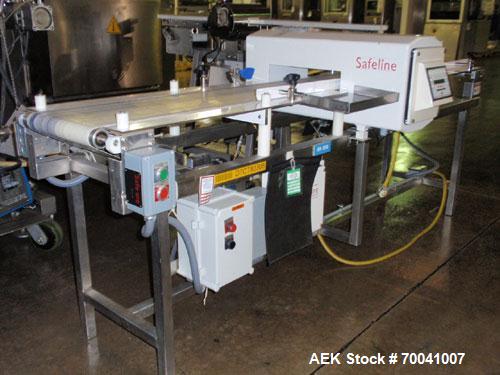 Used Safeline Metal Detector, Model 4500-003-033. Aperture size 14" wide x 2-3/4" high. Includes a control panel, air reject, and a belt conveyor 12" wide x 96" long belt, driven by a 1/2 hp, 3/60/23...