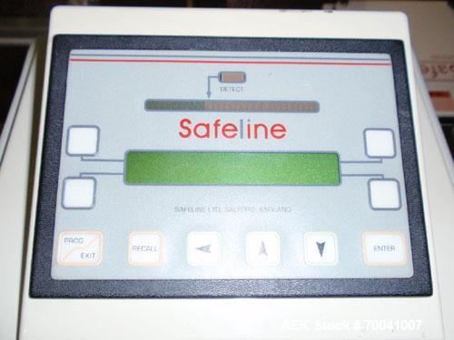 Used Safeline Metal Detector, Model 4500-003-033. Aperture size 14" wide x 2-3/4" high. Includes a control panel, air reject, and a belt conveyor 12" wide x 96" long belt, driven by a 1/2 hp, 3/60/23...