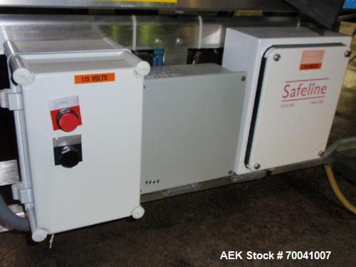 Used Safeline Metal Detector, Model 4500-003-033. Aperture size 14" wide x 2-3/4" high. Includes a control panel, air reject, and a belt conveyor 12" wide x 96" long belt, driven by a 1/2 hp, 3/60/23...