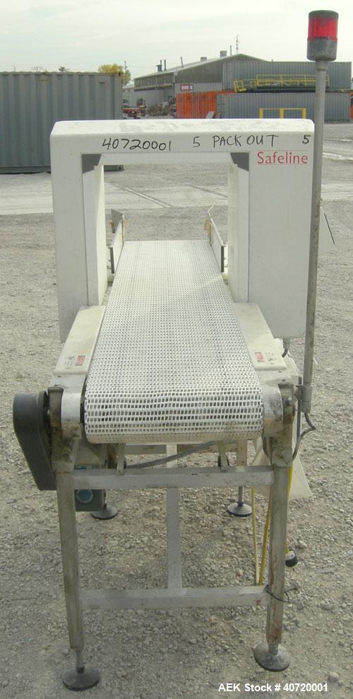 Used Safeline Metal Detector, Model STD18X19-P-300-MD. Aperture size 18" wide x 19" high x 16" long. Includes a control panel and a belt conveyor, 16" wide x 84" long plastic belt, driven by a 1/3 hp...