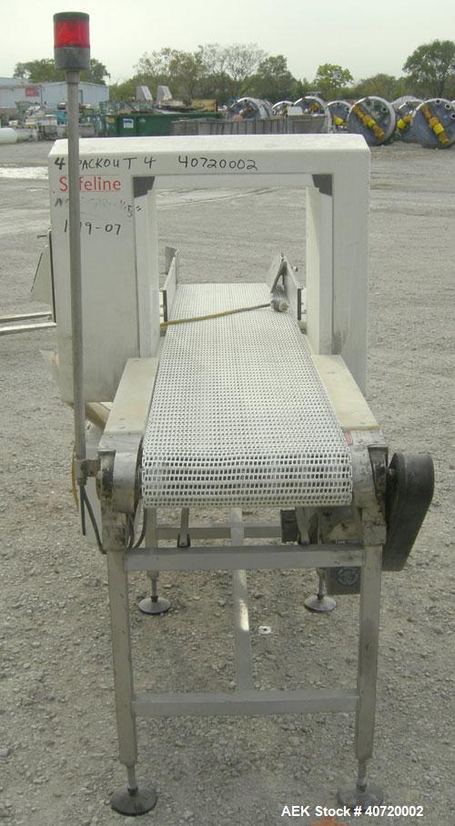 Used Safeline Metal Detector, Model STD18X19-P-300-MD. Aperture size 18" wide x 19" high x 16" long. Includes a control panel and a belt conveyor, 16" wide x 84" long plastic belt, driven by a 1/2 hp...