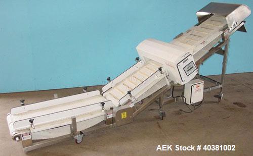Used Safeline Metal Detector, model STD18X5PILV2. 18" x 5" aperature. Detector HeadRef # 110073, M/C# 333, Ref Phase 2638, PWD DR# 165, OOBV 10MV, Firmware Version 2.23. Includes a plastic mesh incli...