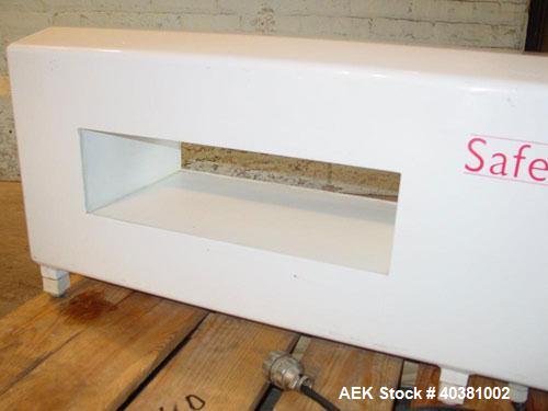 Used Safeline Metal Detector, model STD18X5PILV2. 18" x 5" aperature. Detector HeadRef # 110073, M/C# 333, Ref Phase 2638, PWD DR# 165, OOBV 10MV, Firmware Version 2.23. Includes a plastic mesh incli...