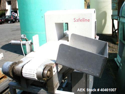 Used Safeline Metal Detector, model ZPMF2 6X9. Aperture size 6" wide x 9" high. Belt conveyor 4" wide x 5' long with 2 side gripper belts with drives. Approximately 7 3/4" clearance from top of belt ...