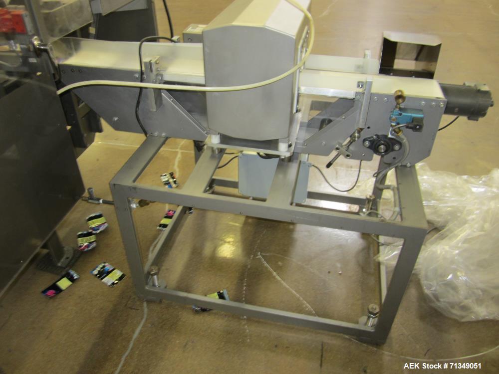 Used Safeline Powerphase Metal Detector. Aperture measures 3-1/2" tall x 5-3/4" wide. Belt conveyor measures 5 "W x 53"L. Includes pneumatic reject. Serial# 61605