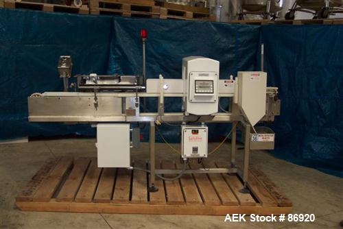 Used Safeline Metal Detector. Aperture size 5" wide x 9-7/8" high x 11-3/8" long. Requires belt and motor for conveyor, includes a Morrison timing screw conveyor, model B01118555-001, driven by a DC ...