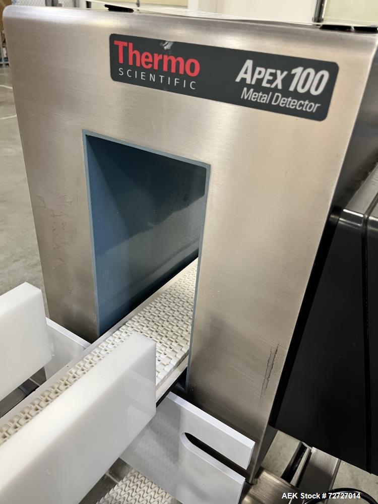 Used Thermo Scientific Conveyor Mounted Metal Detector, Model Apex 100. 304 Stainless Steel. Aperture size: 5 3/4 " wide x 10" tall from the conveyor belt that product can pass through. Reject is air...