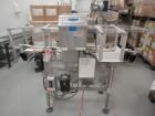 Used Loma Model IQ2 Metal Detector with conveyor and reject. Metal detector is vertical and last set up for solid dose bottling line. Head is 5