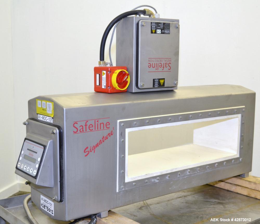 Used Safeline Signature 2 Pass Through Metal Detector, 304 Stainless Steel. Aperture size approximately 25-1/2" wide x 7" high x 11" long. Sensitivity Ratio dependent of coil system at 300 kHz, Non-F...