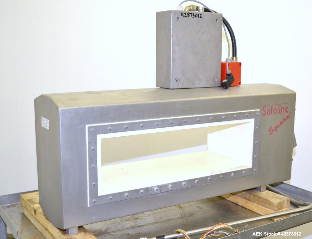 Used Safeline Signature 2 Pass Through Metal Detector, 304 Stainless Steel. Aperture size approximately 25-1/2" wide x 7" high x 11" long. Sensitivity Ratio dependent of coil system at 300 kHz, Non-F...