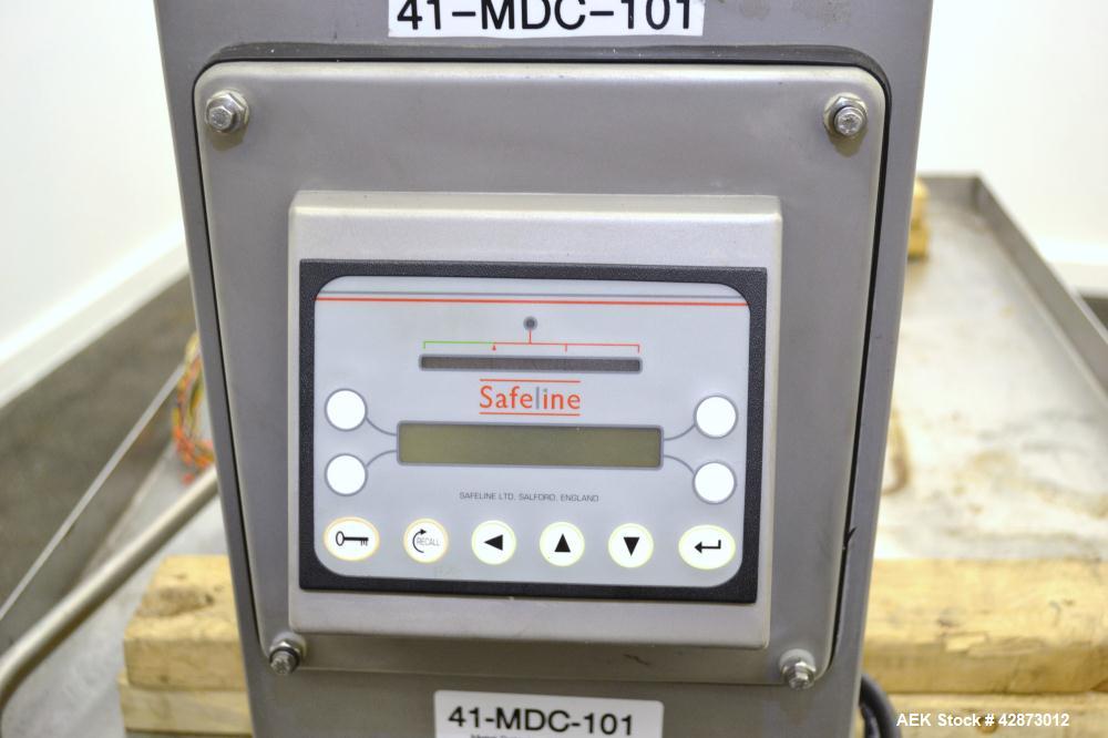 Used Safeline Signature 2 Pass Through Metal Detector, 304 Stainless Steel. Aperture size approximately 25-1/2" wide x 7" high x 11" long. Sensitivity Ratio dependent of coil system at 300 kHz, Non-F...