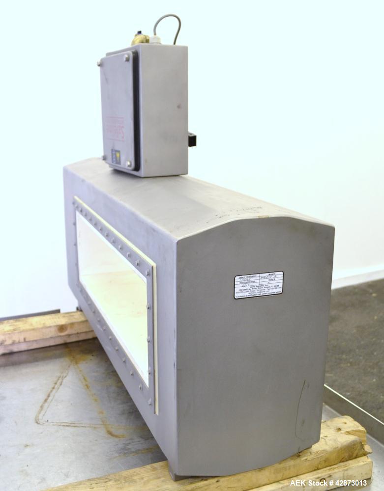 Used Safeline Signature Pass Through Metal Detector, 304 Stainless Steel. Aperture size approximately 25-1/2" wide x 7" high x 11" long. Sensitivity Ratio dependent of coil system at 300 kHz, Non-Fer...