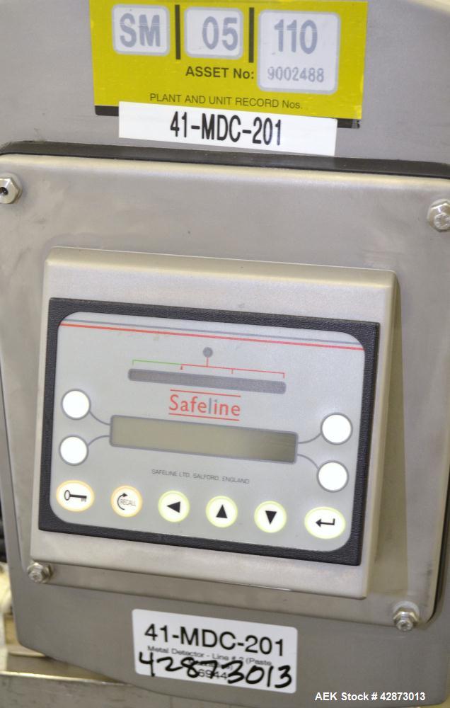 Used Safeline Signature Pass Through Metal Detector, 304 Stainless Steel. Aperture size approximately 25-1/2" wide x 7" high x 11" long. Sensitivity Ratio dependent of coil system at 300 kHz, Non-Fer...