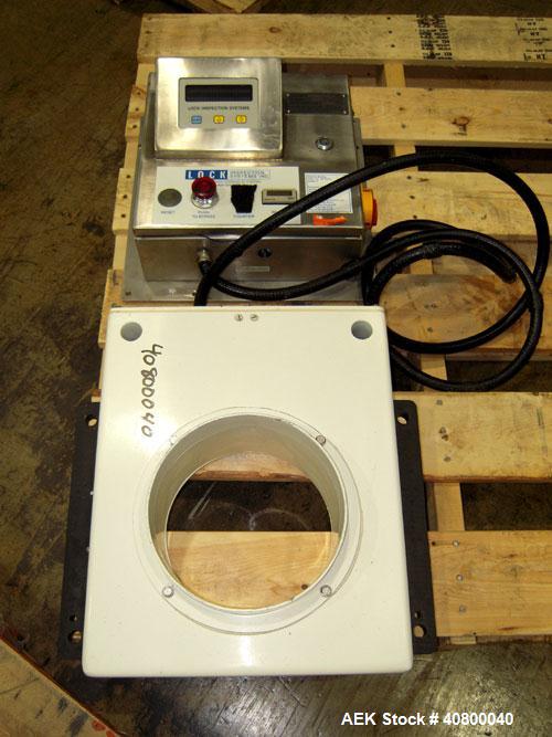 Used Lock Inspection Systems Metal Detector. Aperature size approximately 8 5/8" diameter x 4" deep. Includes a control panel.