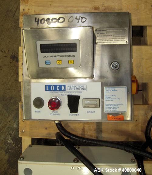 Used Lock Inspection Systems Metal Detector. Aperature size approximately 8 5/8" diameter x 4" deep. Includes a control panel.