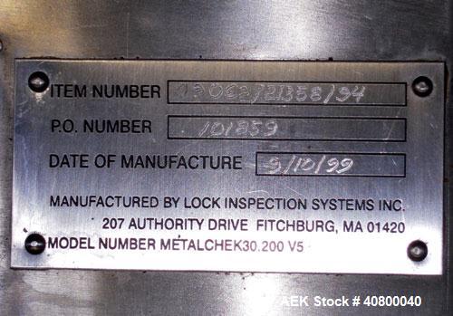 Used Lock Inspection Systems Metal Detector. Aperature size approximately 8 5/8" diameter x 4" deep. Includes a control panel.