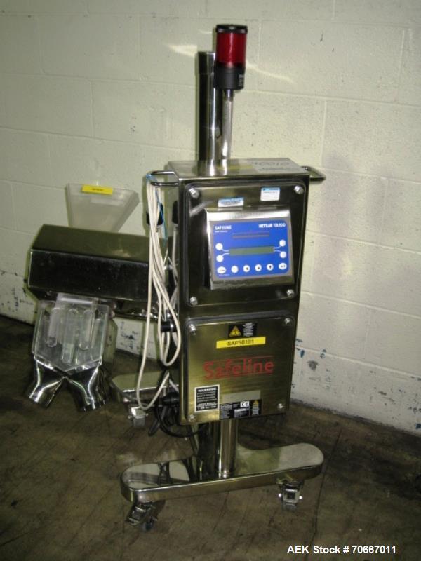 Used Safline metal detector, 3.75" x 1.5" aperature, with diverter, on stainless steel stand, serial # 50131.  NOTE: PRICE INCLUDES A 15% BUYERS PREMIUM.